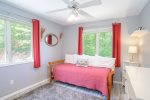 Main level guest bedroom has a daybed with a trundle